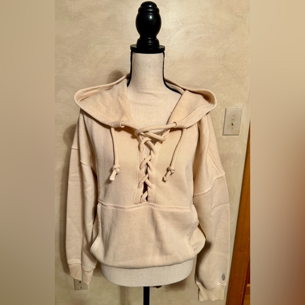 Free People Movement hoodie with tie up detail in size medium